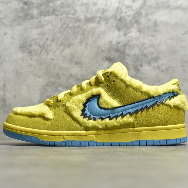 Outside view of Yellow Bear Dunks reps with stash tongue