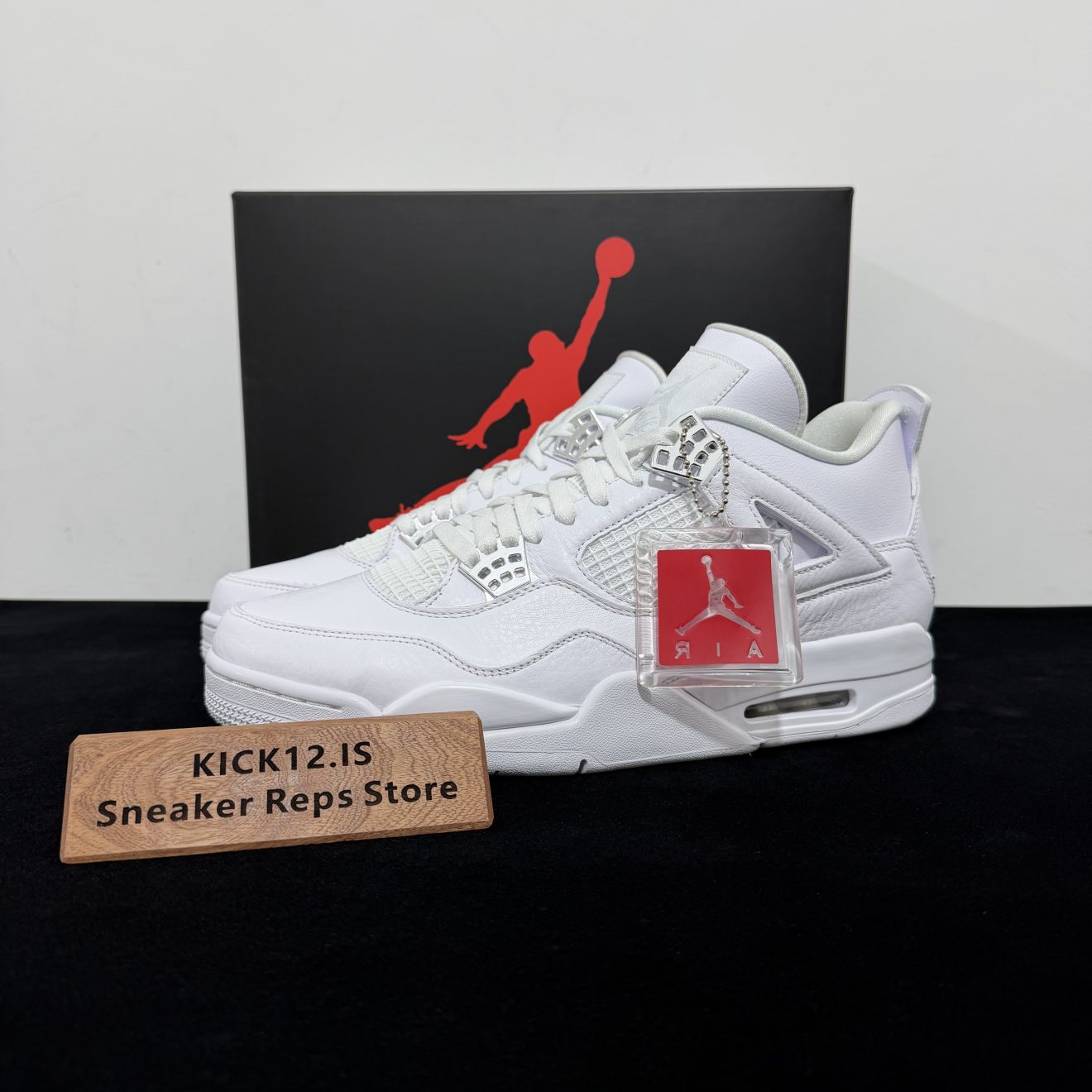 Jordan 4 Pure Money Reps with box displayed on table