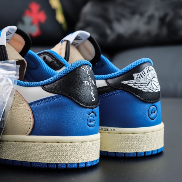 Angled heel view of Travis Scott Fragment Design Jordan 1 Low reps with dual heel branding