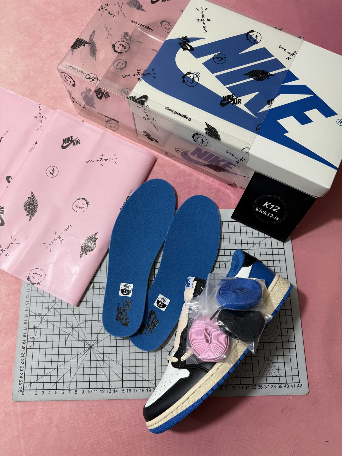 Complete package with box, printed paper, insoles, and extra laces for Travis Scott Fragment reps