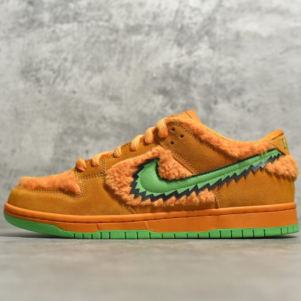 outside view of Orange Bear SB Dunks with stash tongue pocket
