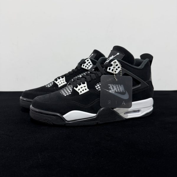 Side view of Jordan 4 White Thunder Reps with Nike Tag