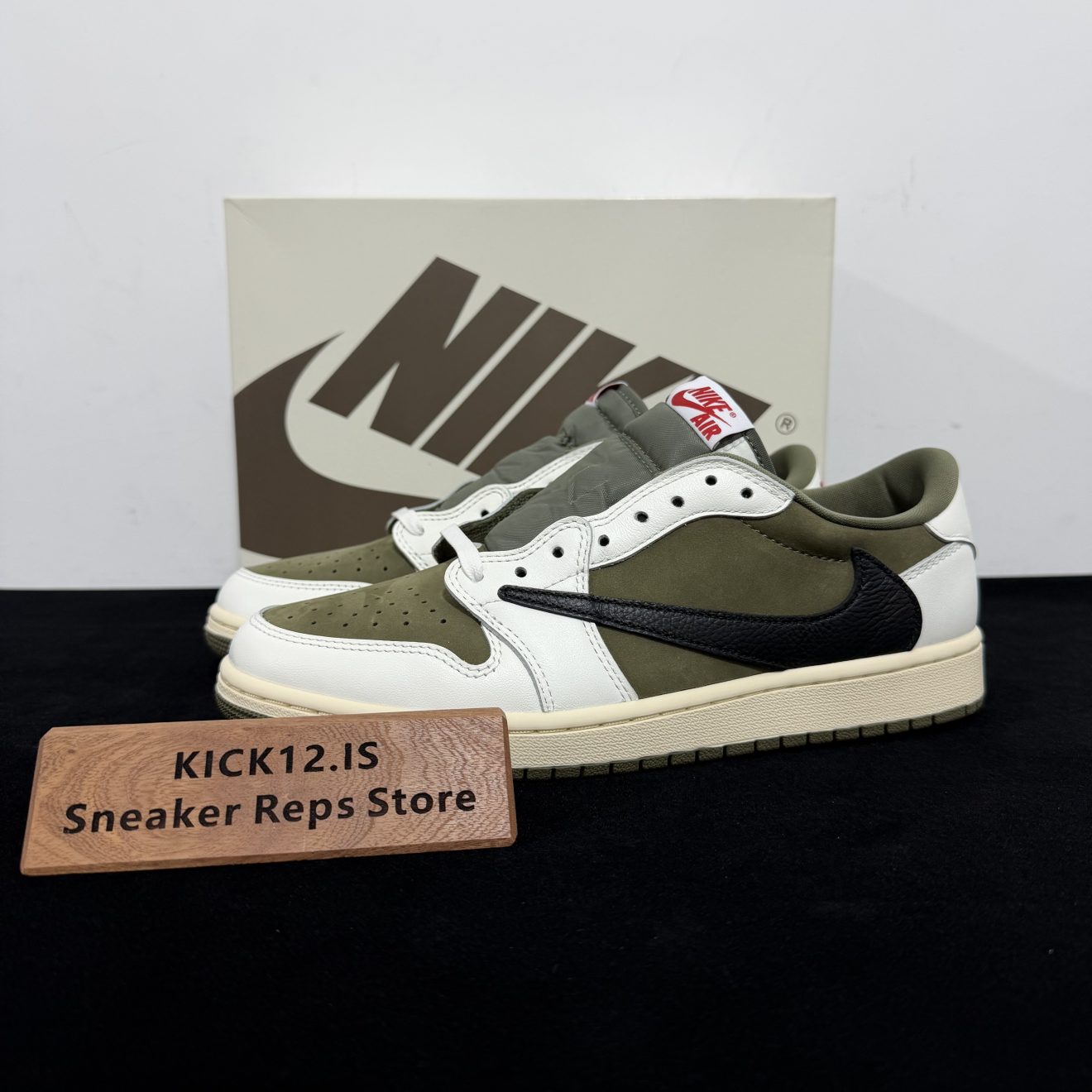 Jordan 1 Travis Scott Medium Olive Reps with box displayed on table