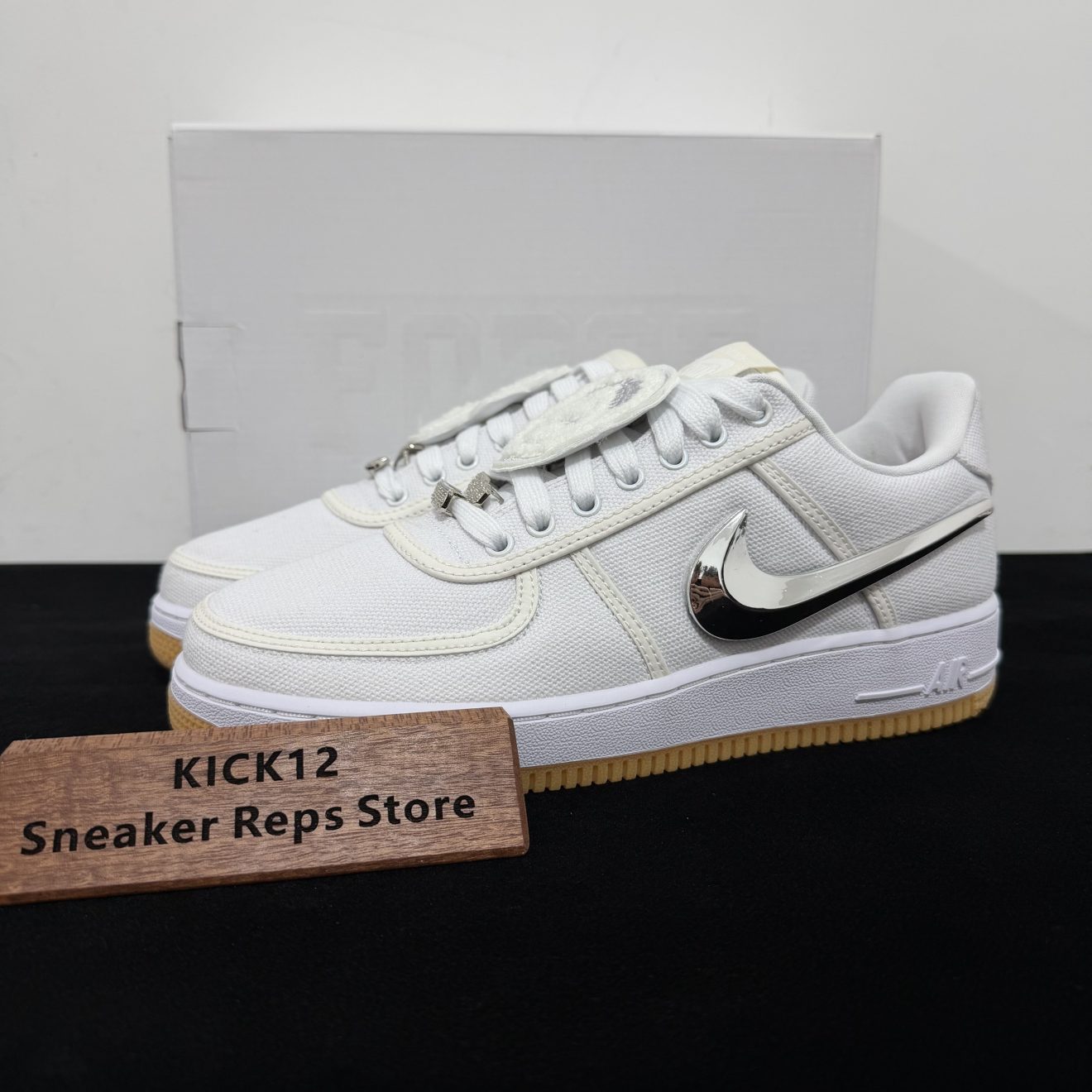 Travis Scott AF1 Reps with box displayed on table