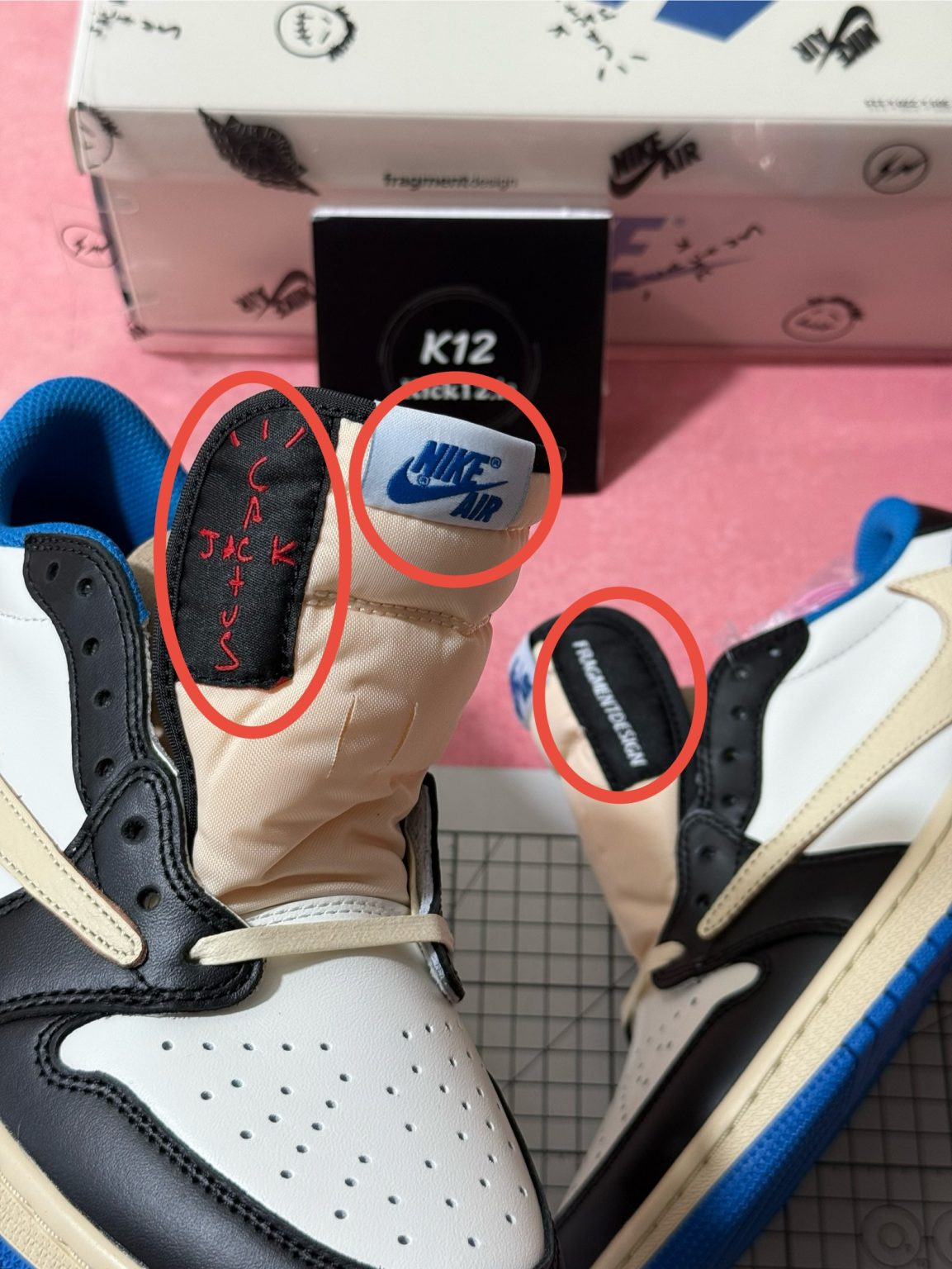 Travis Scott and Fragment co-branded heel and tongue logos on Jordan 1 reps