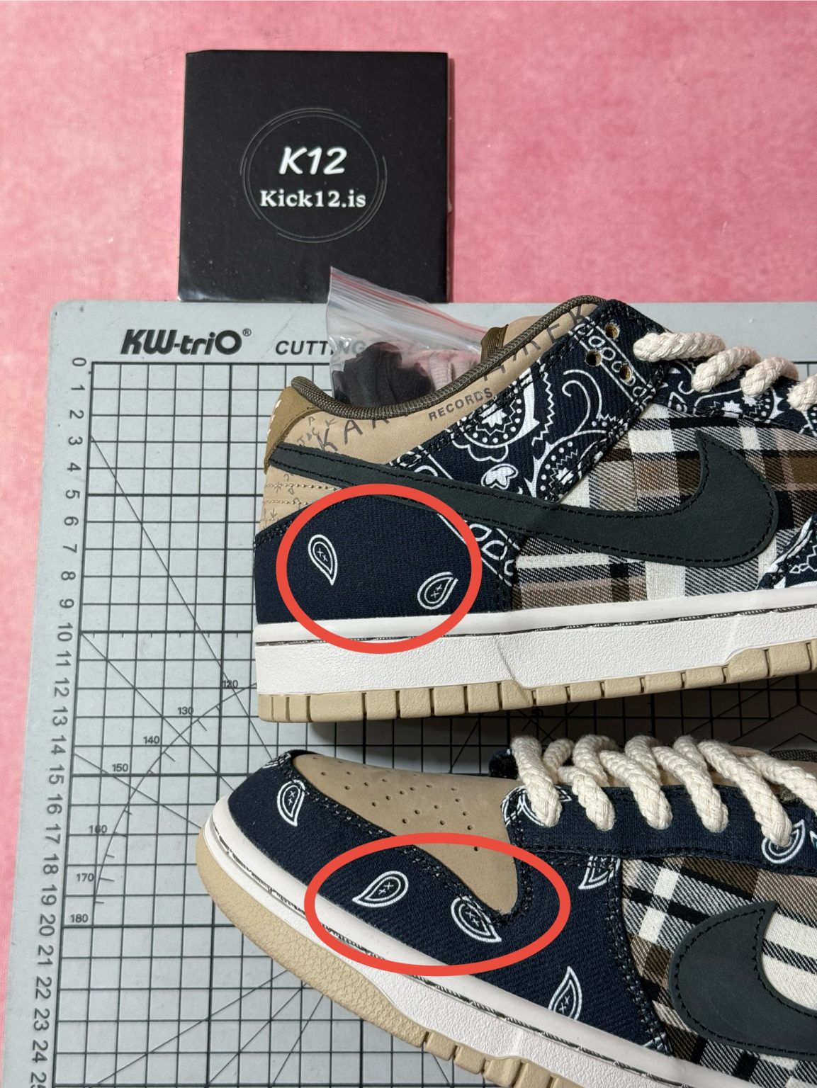 Bright paisley embroidery on navy bandana overlays of Travis Scott Dunk reps