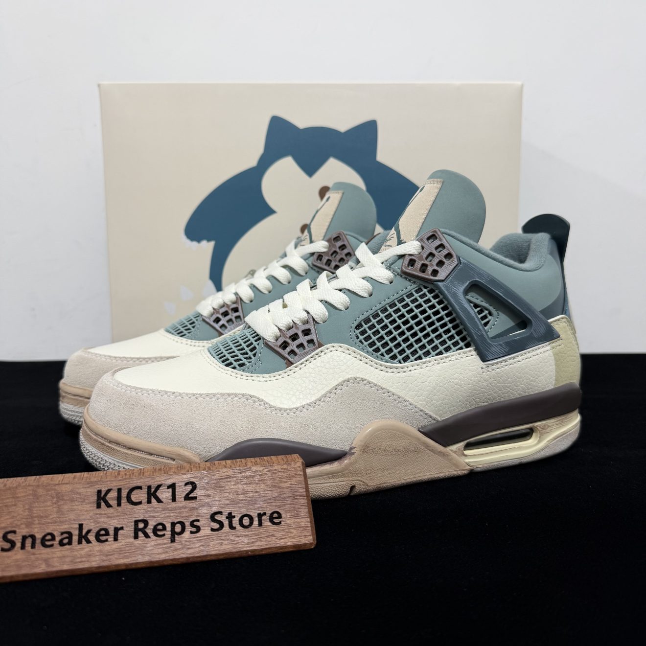 Air Jordan 4 Snorlax Reps with box displayed on table