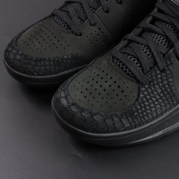 Toebox close-up of Kobe 4 Black Mamba reps with textured upper