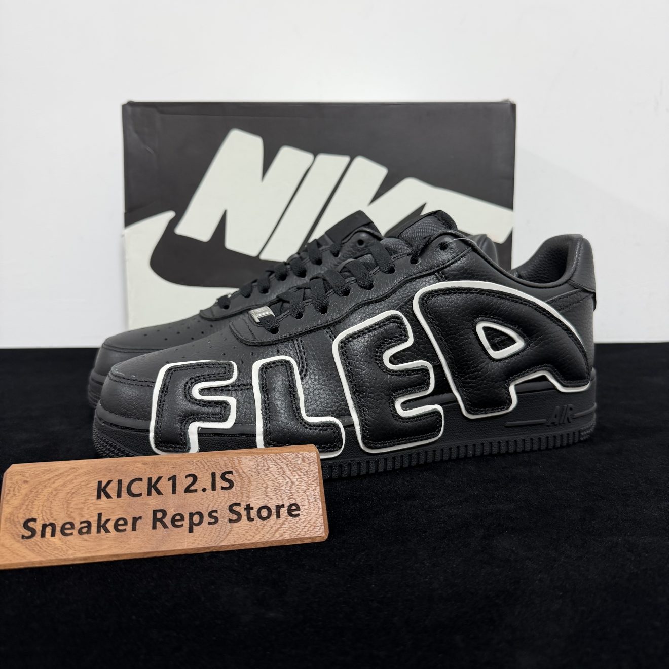 CPFM Air Force 1 Black Reps with box displayed on table