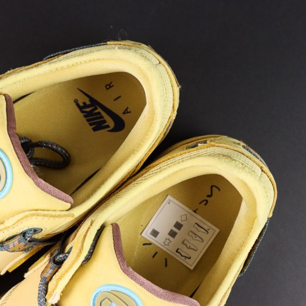 Cactus Jack tongue logo on Air Max 1 Saturn Gold Reps in gold tones