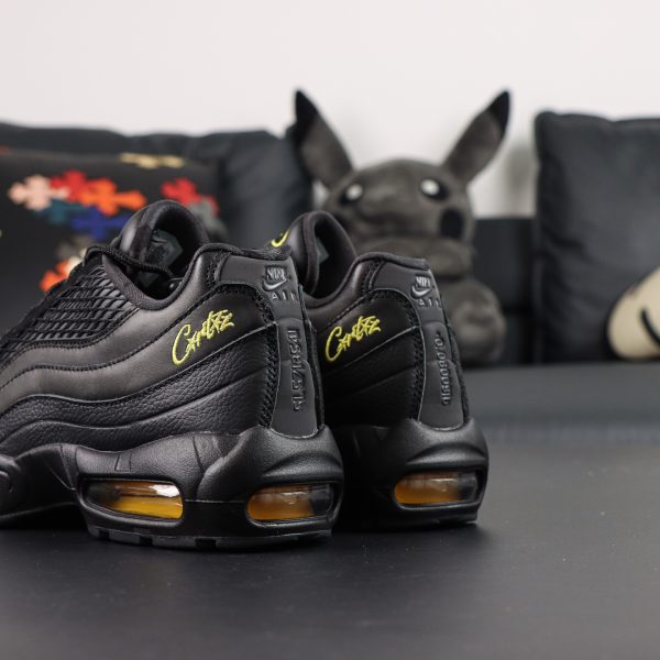 Rear angle of Air Max 95 Corteiz reps showing Alcatraz heel logo and layered upper