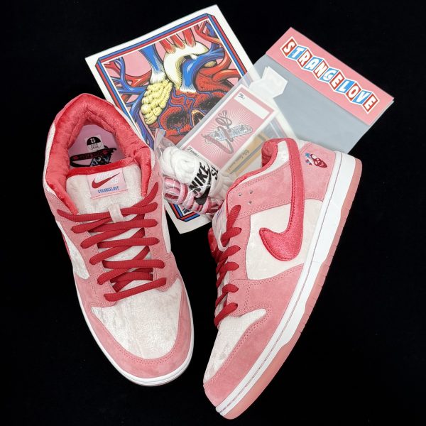 Top-down view of Strangelove Dunks Reps with extra laces and packaging