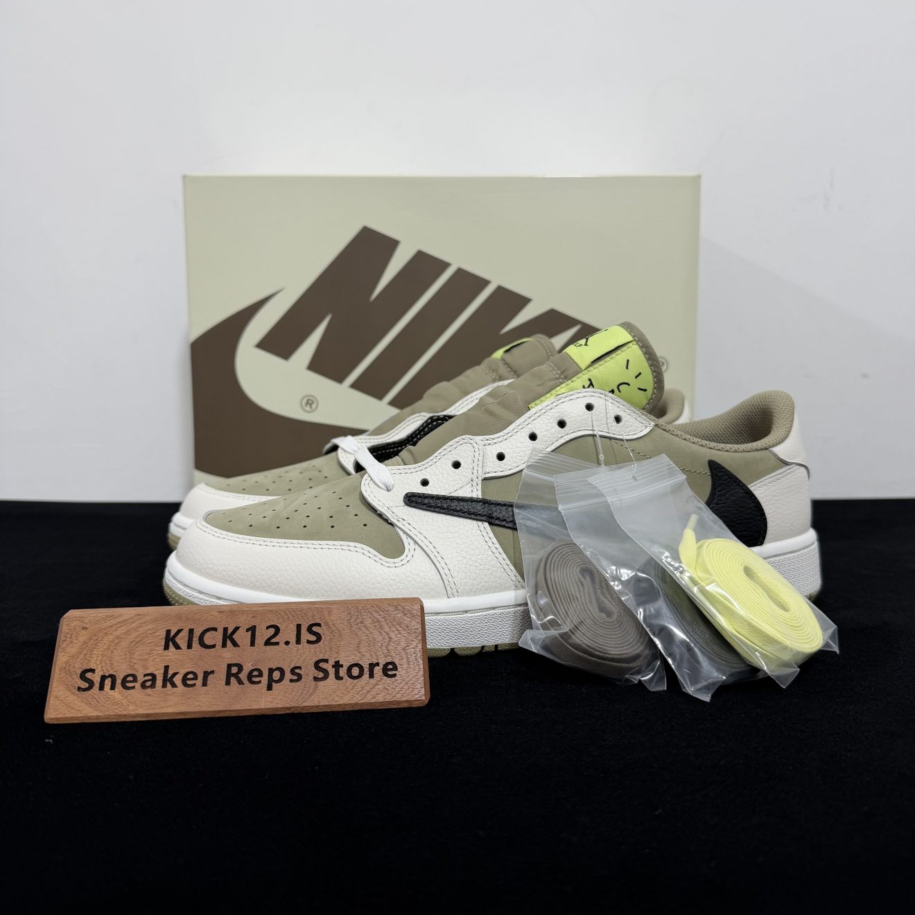 Travis Scott Golf Shoes Reps with box displayed on table