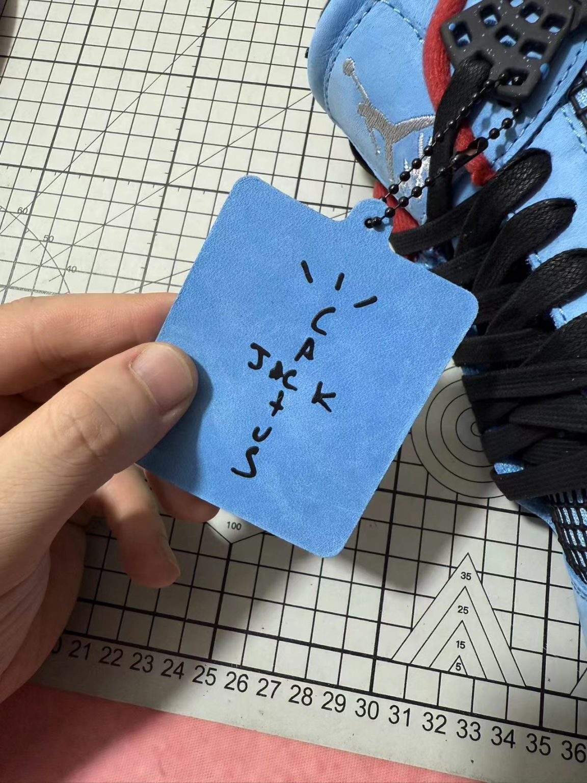 Cactus Jack printed insole and hang tag on Jordan 4 Travis Scott reps