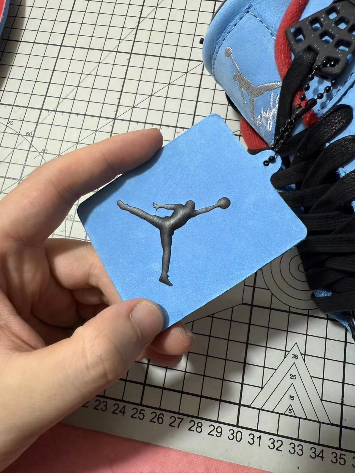 Cactus Jack printed insole and hang tag on Jordan 4 Travis Scott reps