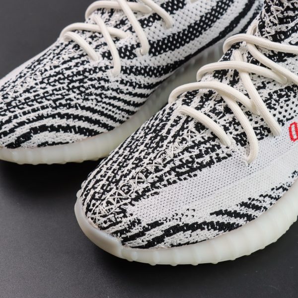 Front view of Yeezy 350 Zebra reps showing striped Primeknit pattern