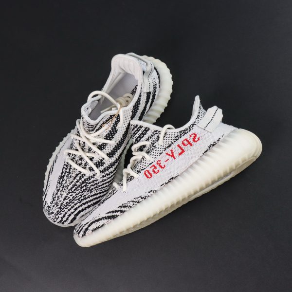 Top-down view of Yeezy 350 Zebra reps with red lateral SPLY-350