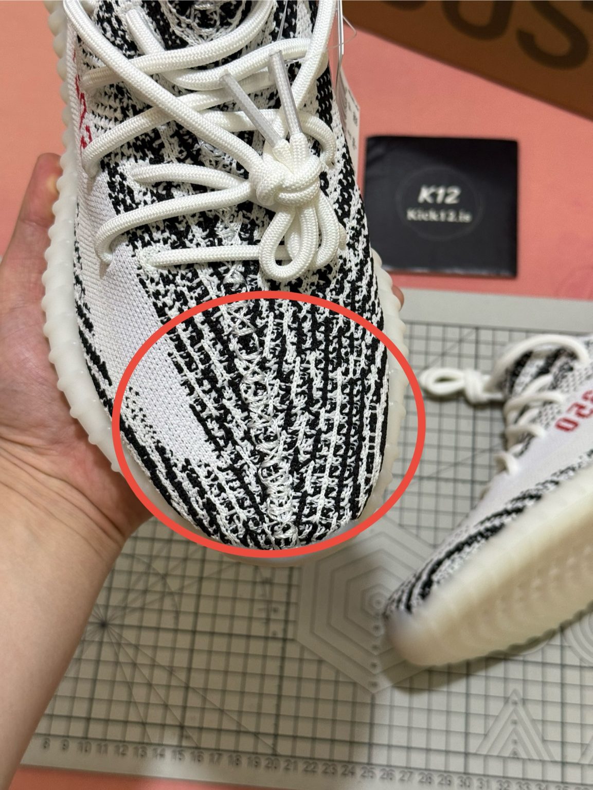 Breathable Primeknit upper on Yeezy 350 Zebra reps with iconic black and white pattern