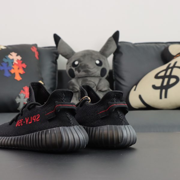Heel side of Yeezy 350 Bred reps showing Primeknit and pull tab