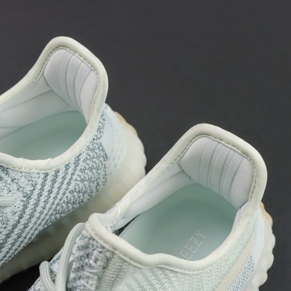 Tongue padding of Yeezy 350 Cloud White reps with no visible branding