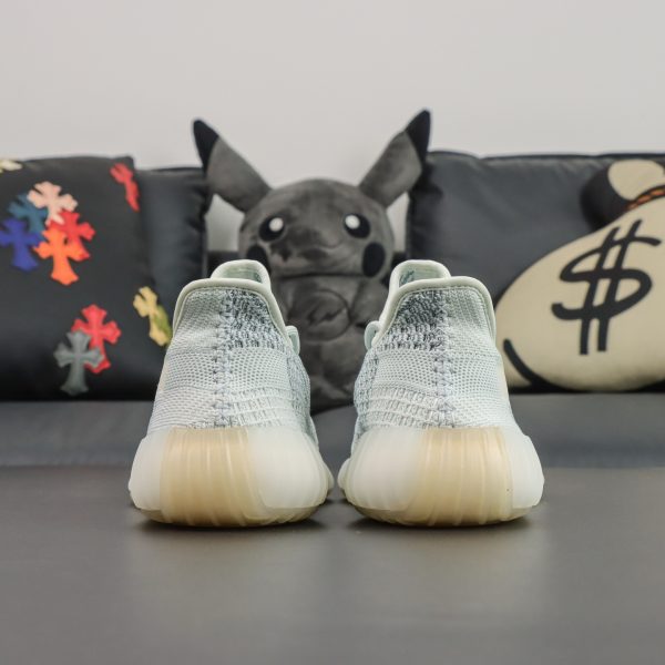 Rear heel view of Yeezy 350 Cloud White reps with ribbed midsole structure