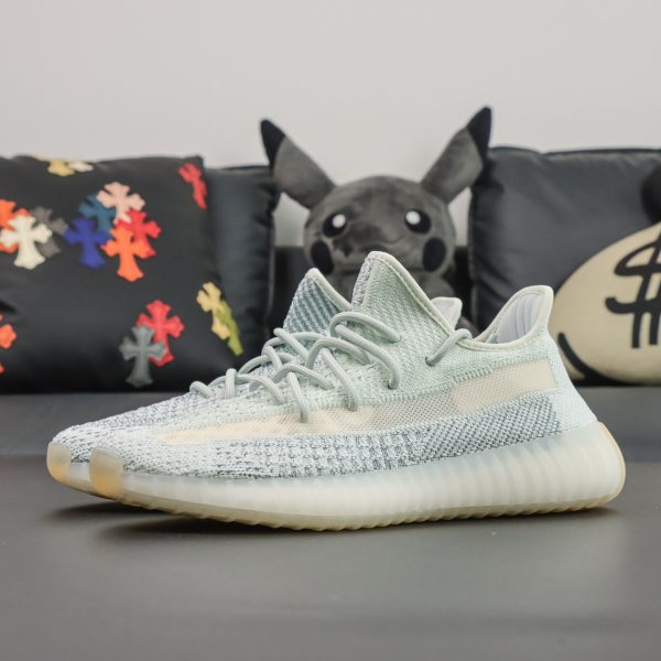 Side view of both Cloud White Yeezy 350 reps showing monofilament stripe