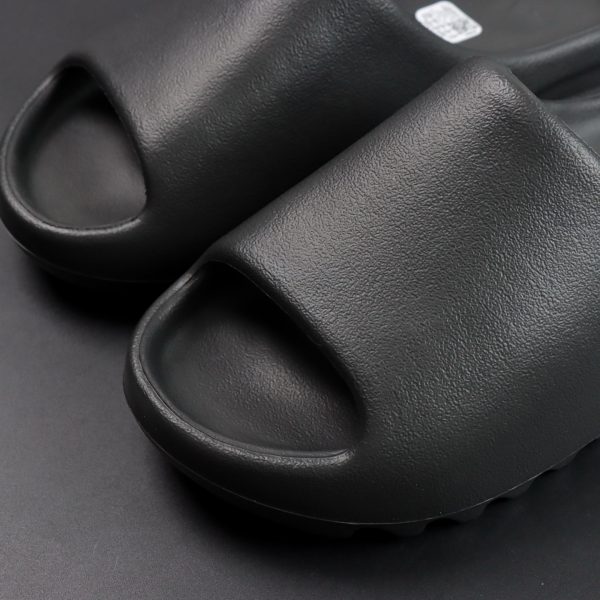 Front angle of Yeezy Slide Onyx Reps showing rounded toe