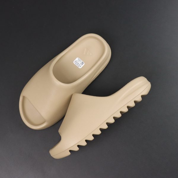 Top-down view of Yeezy Slide Pure pair in neutral tone