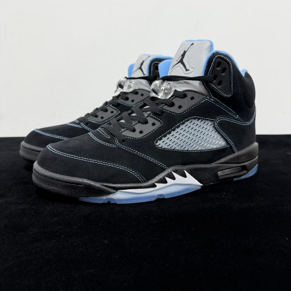 Side view of Air Jordan 5 Black University Blue 2026 Reps with black upper and blue accents