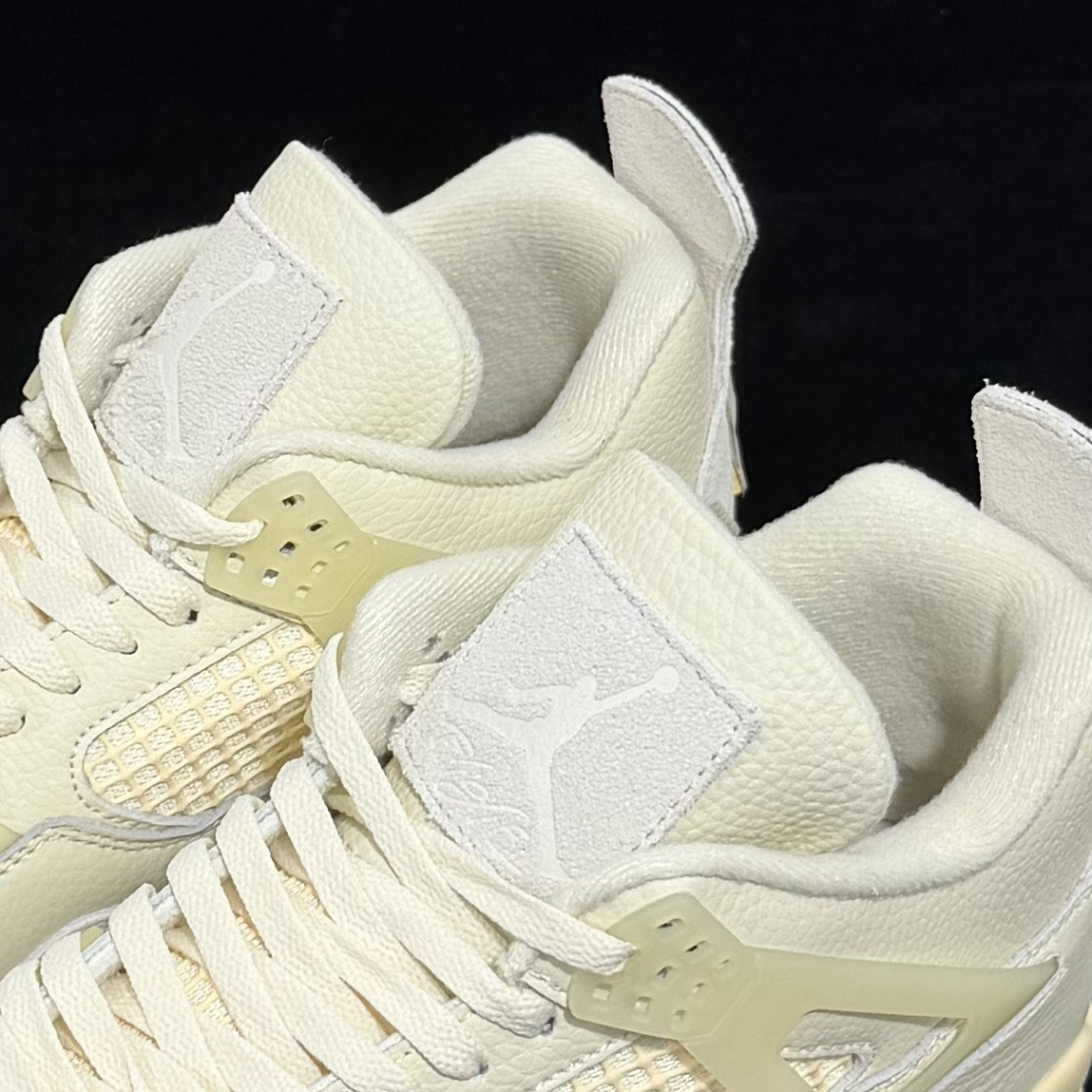 Tongue logo detail on Jordan 4 Birds of Paradise Reps