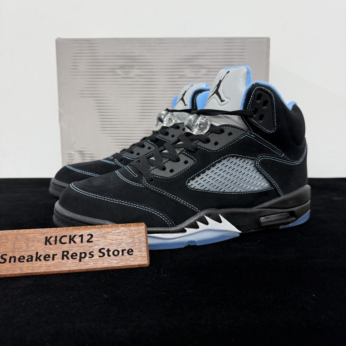 Air Jordan 5 Black University Blue 2026 Reps with box displayed on table